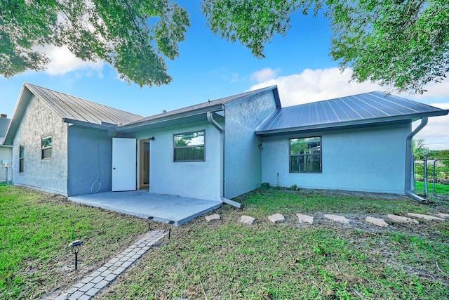 back of property featuring a patio area