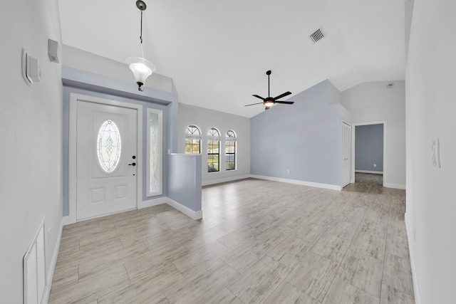 entryway with light hardwood / wood-style flooring, vaulted ceiling, and ceiling fan