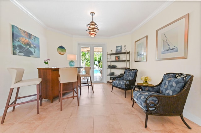 sitting room featuring crown molding, french doors, and light tile patterned floors