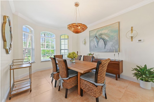 dining area featuring crown molding, light tile patterned floors, and an inviting chandelier