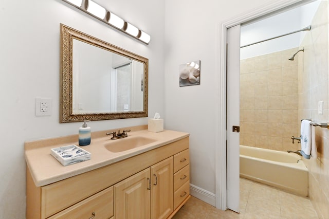 bathroom with tile patterned flooring, vanity, and tiled shower / bath combo