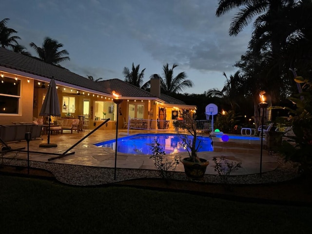 view of pool featuring an outdoor living space and a patio