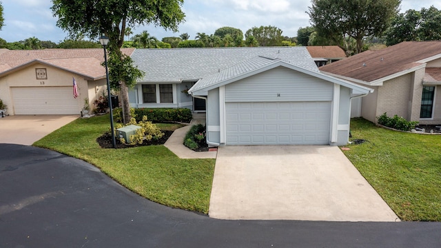 ranch-style home with a front lawn and a garage