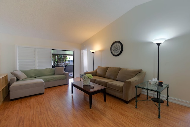 14 Grange Pl, Boynton Beach, FL 33426 - living area with lofted ceiling and light wood-style flooring