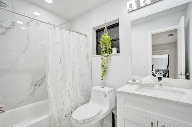 full bathroom with vanity, toilet, and shower / tub combo with curtain