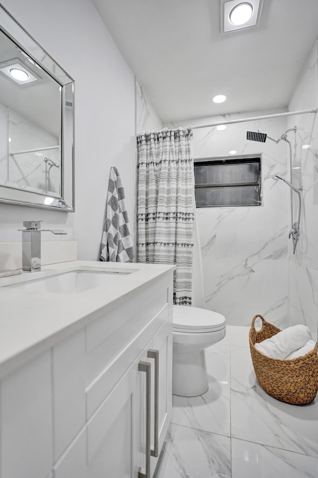 bathroom with vanity, toilet, and walk in shower