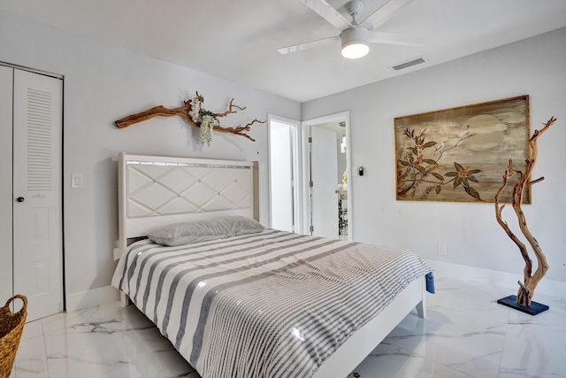 bedroom with ceiling fan and a closet