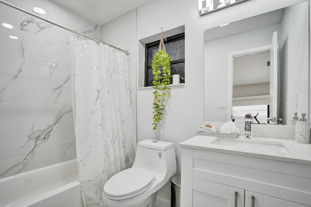 full bathroom with vanity, toilet, and shower / bath combo