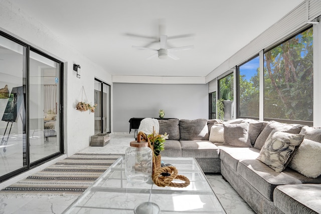 sunroom featuring ceiling fan