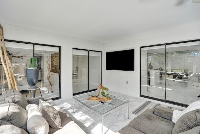 bedroom featuring access to exterior, two closets, and ceiling fan