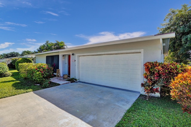 ranch-style house featuring a garage