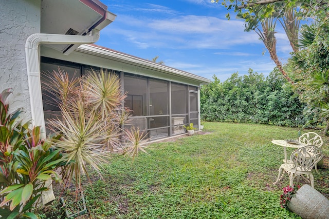 view of yard featuring a sunroom