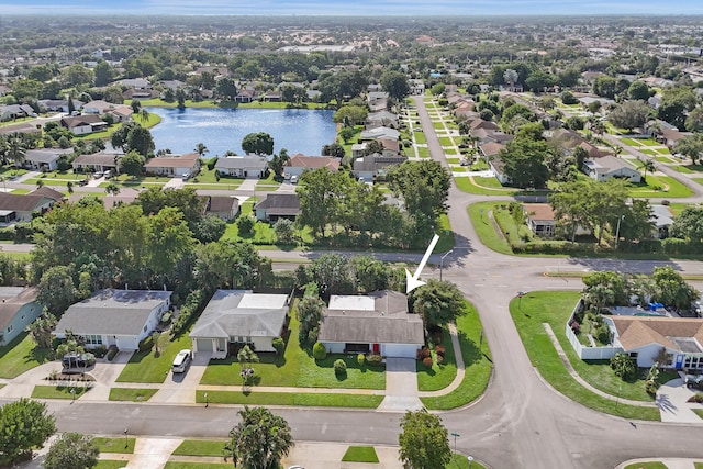 birds eye view of property with a water view