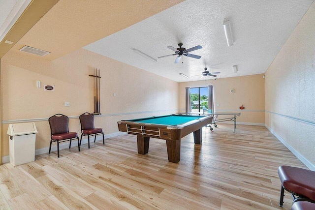 recreation room with a textured ceiling, light wood-type flooring, ceiling fan, and pool table