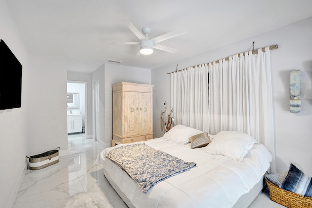 bedroom featuring ceiling fan and connected bathroom