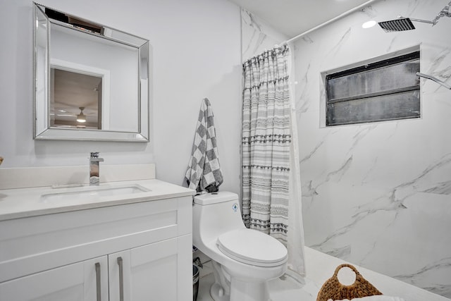 bathroom featuring a shower with curtain, vanity, and toilet