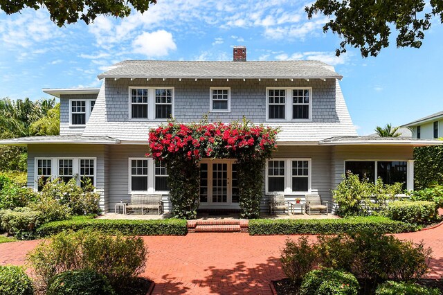 rear view of property with a patio area and french doors