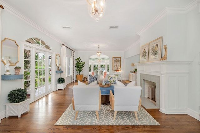 dining area featuring dark wood-type flooring and crown molding