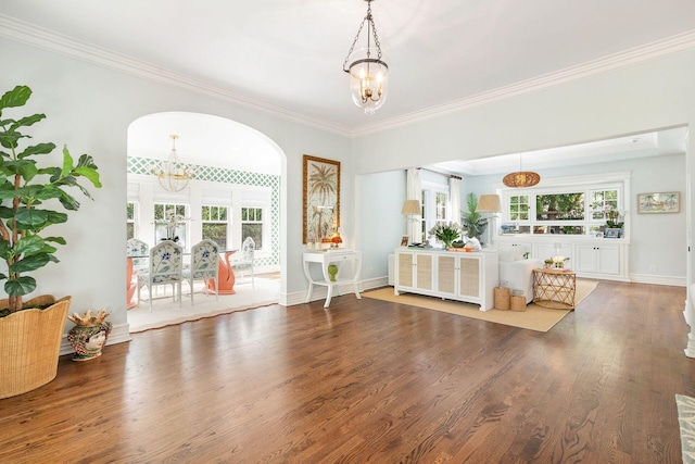 interior space with ornamental molding, hardwood / wood-style floors, and plenty of natural light