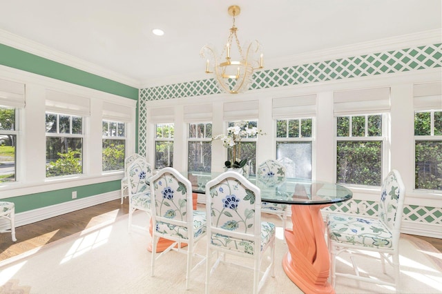 sunroom with a chandelier and plenty of natural light