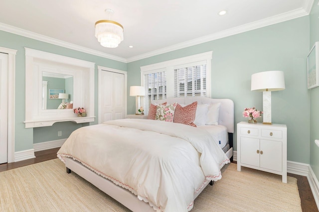 bedroom featuring a closet, crown molding, and light wood-type flooring