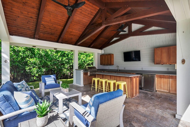 view of patio / terrace with a gazebo, ceiling fan, an outdoor wet bar, outdoor lounge area, and a grill