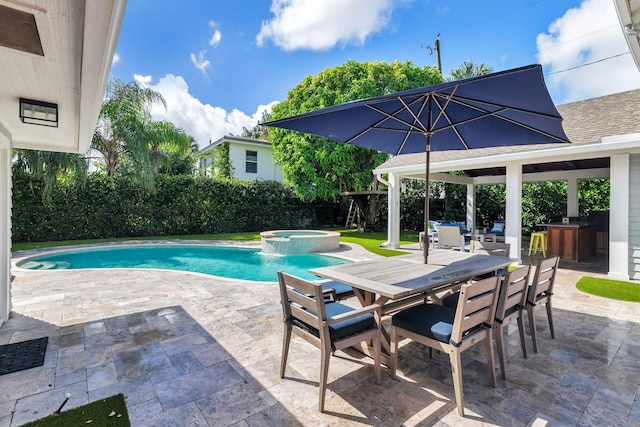 view of swimming pool featuring an in ground hot tub and a patio area