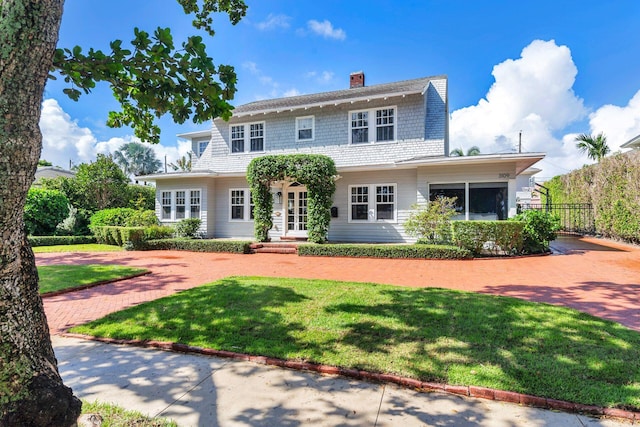 view of front of home with a front lawn