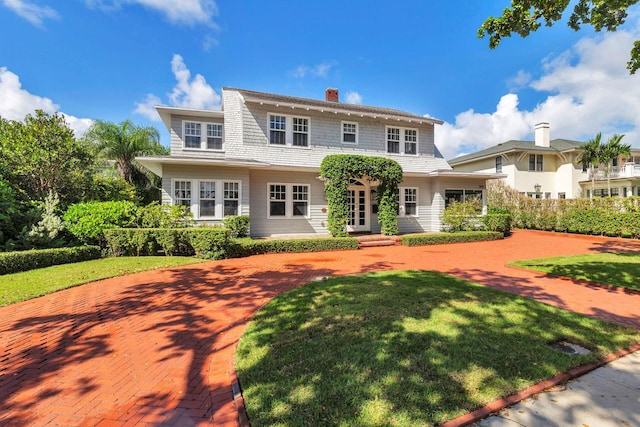 view of front of property with a front lawn