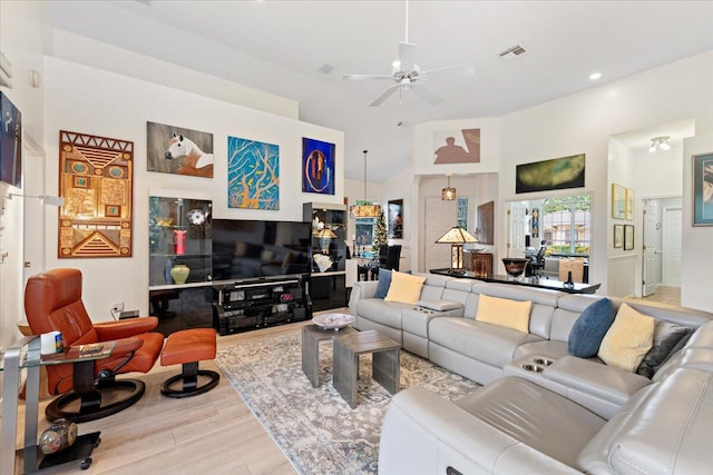 living room featuring light wood-type flooring and ceiling fan