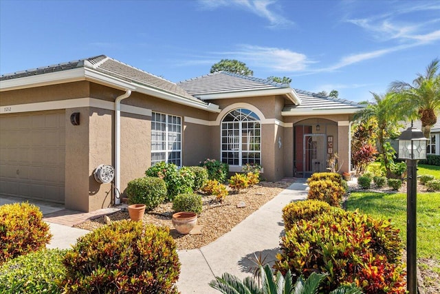 single story home featuring a garage