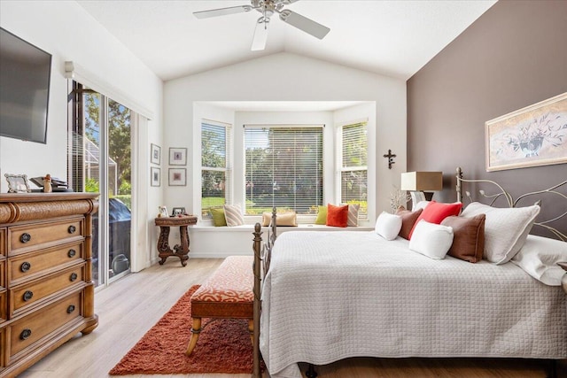 bedroom with lofted ceiling, light hardwood / wood-style floors, and ceiling fan