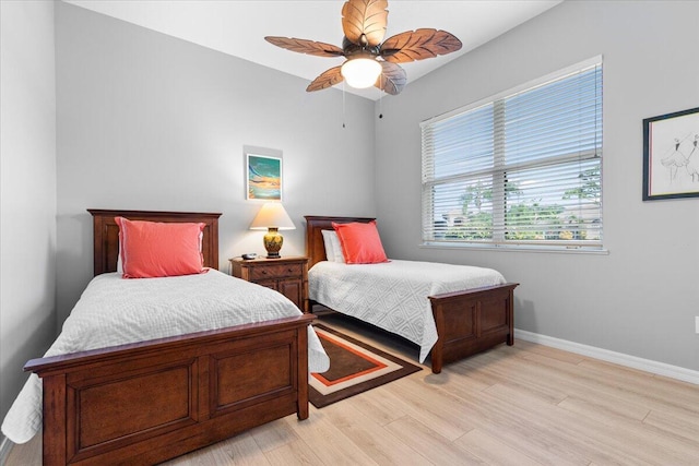 bedroom with light wood-type flooring and ceiling fan