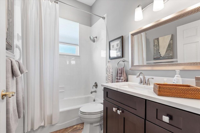 full bathroom featuring vanity, shower / bath combo, wood-type flooring, and toilet