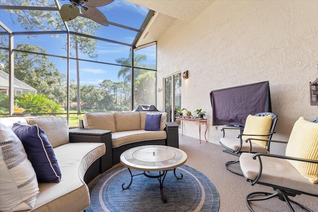 view of patio / terrace with an outdoor living space and glass enclosure