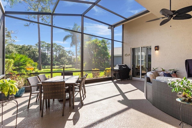 sunroom featuring ceiling fan