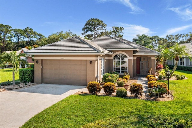 ranch-style home with a front yard and a garage