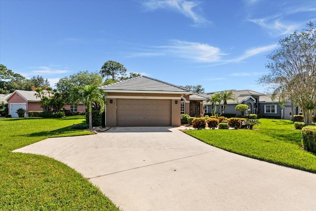 ranch-style house with a garage and a front lawn