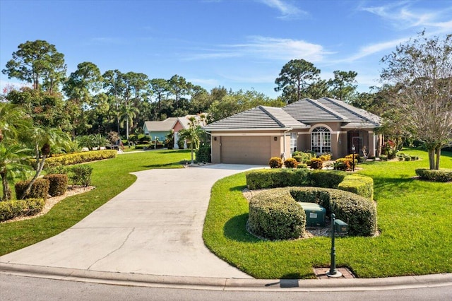 single story home with a front lawn and a garage