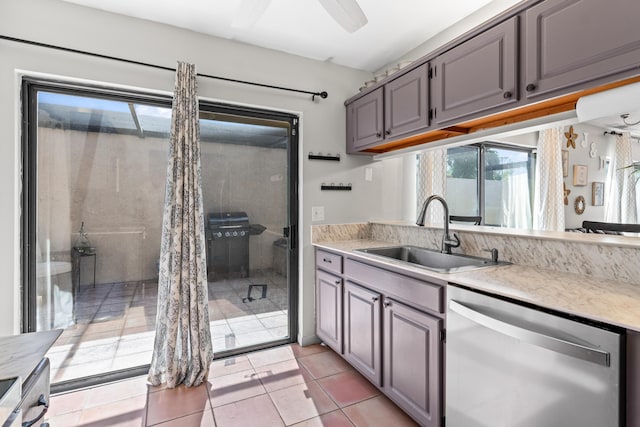 kitchen with gray cabinets, light tile patterned flooring, sink, stainless steel dishwasher, and ceiling fan