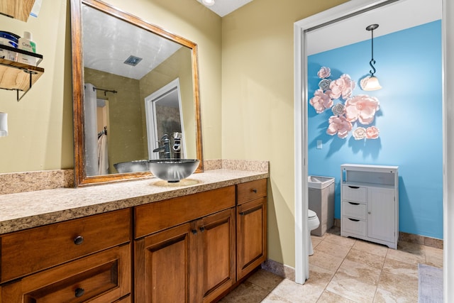 bathroom with vanity and toilet