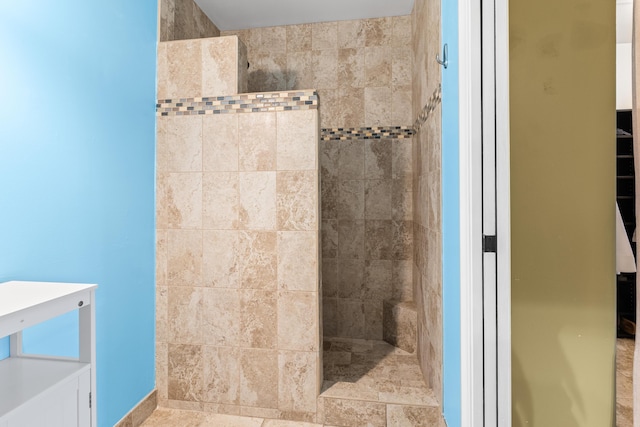 bathroom with tiled shower