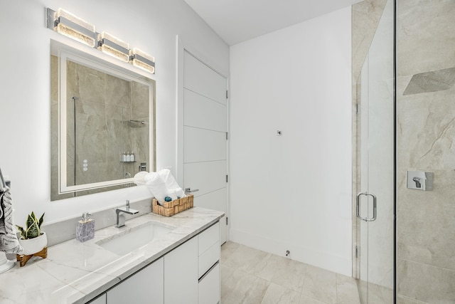 bathroom with walk in shower and vanity