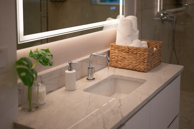 bathroom with an enclosed shower and vanity