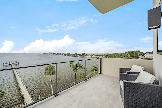 balcony featuring a water view