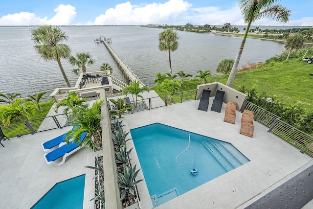 view of swimming pool featuring a water view and a patio area