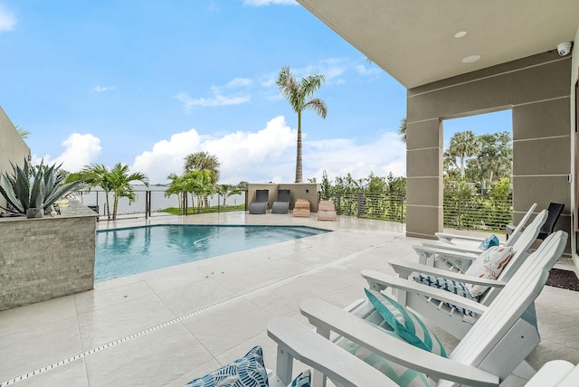 view of swimming pool featuring a patio