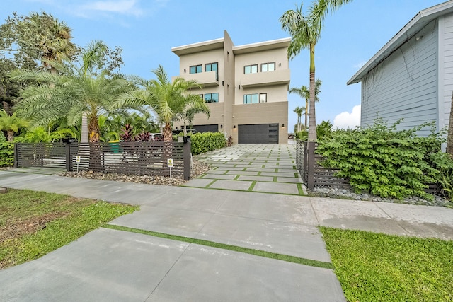 view of front of home with a balcony and a garage