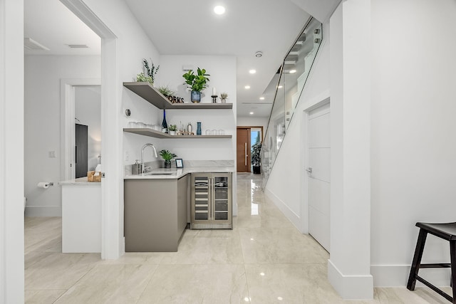 bar featuring wine cooler and sink