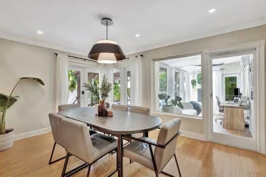 dining space featuring light hardwood / wood-style flooring, french doors, and plenty of natural light